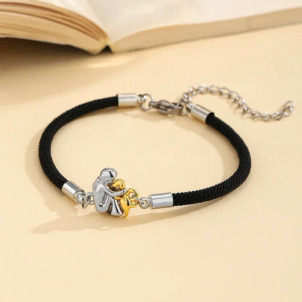 Lucia Milano | Pulsera con cordón e icono de perro.
